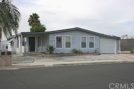 a grey house with a outdoor space