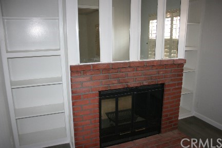 1350 Cabrillo Drive Hemet, CA 92543 - Photo 12 of 30 a room with fireplace and a wooden floor