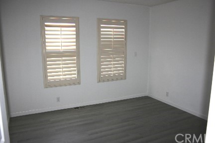 1350 Cabrillo Drive Hemet, CA 92543 - Photo 19 of 30 wooden floor and window in an empty room
