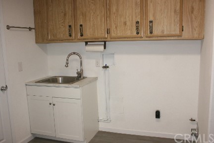 1350 Cabrillo Drive Hemet, CA 92543 - Photo 21 of 30 a bathroom with a sink and cabinets