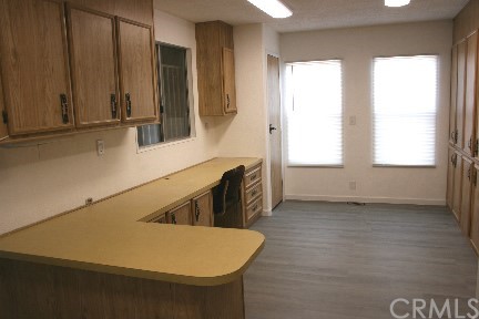 1350 Cabrillo Drive Hemet, CA 92543 - Photo 26 of 30 a kitchen with windows and refrigerator