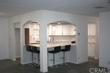 1350 Cabrillo Drive Hemet, CA 92543 - Photo 5 of 30 a kitchen with stainless steel appliances kitchen island a chandelier and cabinets