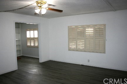 1350 Cabrillo Drive Hemet, CA 92543 - Photo 10 of 30 an empty room with wooden floor and windows