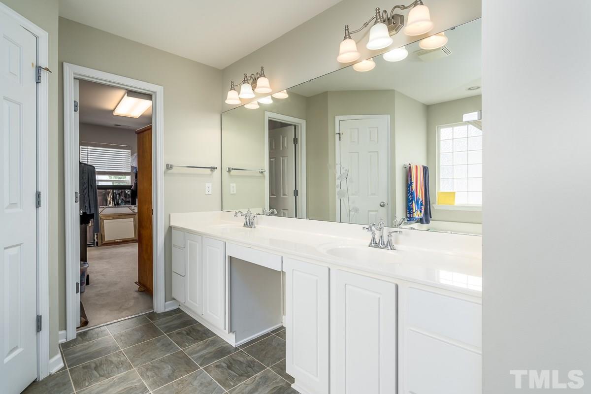 3612 Weir Way Raleigh, NC 27616 - Photo 13 of 19 a bathroom with a sink vanity and a mirror