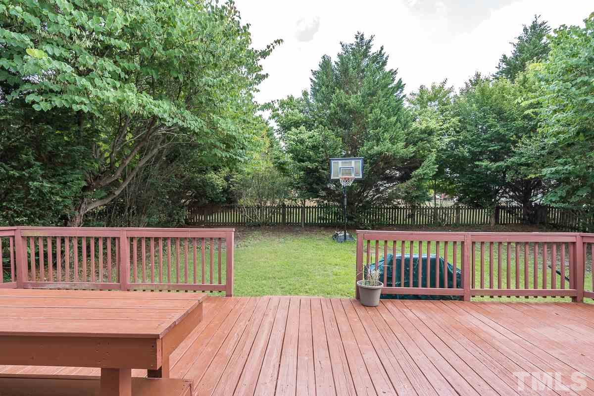 3612 Weir Way Raleigh, NC 27616 - Photo 18 of 19 a view of a deck with a floor to ceiling window and wooden floor