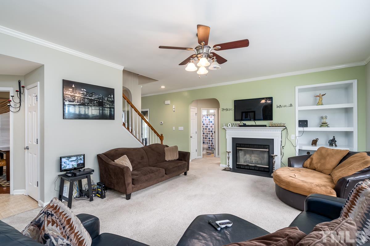 3612 Weir Way Raleigh, NC 27616 - Photo 6 of 19 a living room with furniture and a fireplace