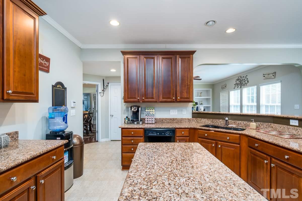 3612 Weir Way Raleigh, NC 27616 - Photo 8 of 19 a kitchen with stainless steel appliances granite countertop a sink stove and refrigerator