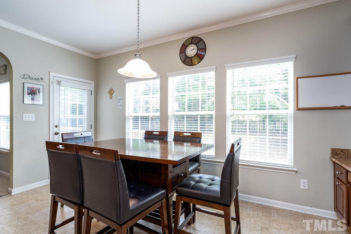 3612 Weir Way Raleigh, NC 27616 - Photo 9 of 19 a dining room with wooden floor and a window