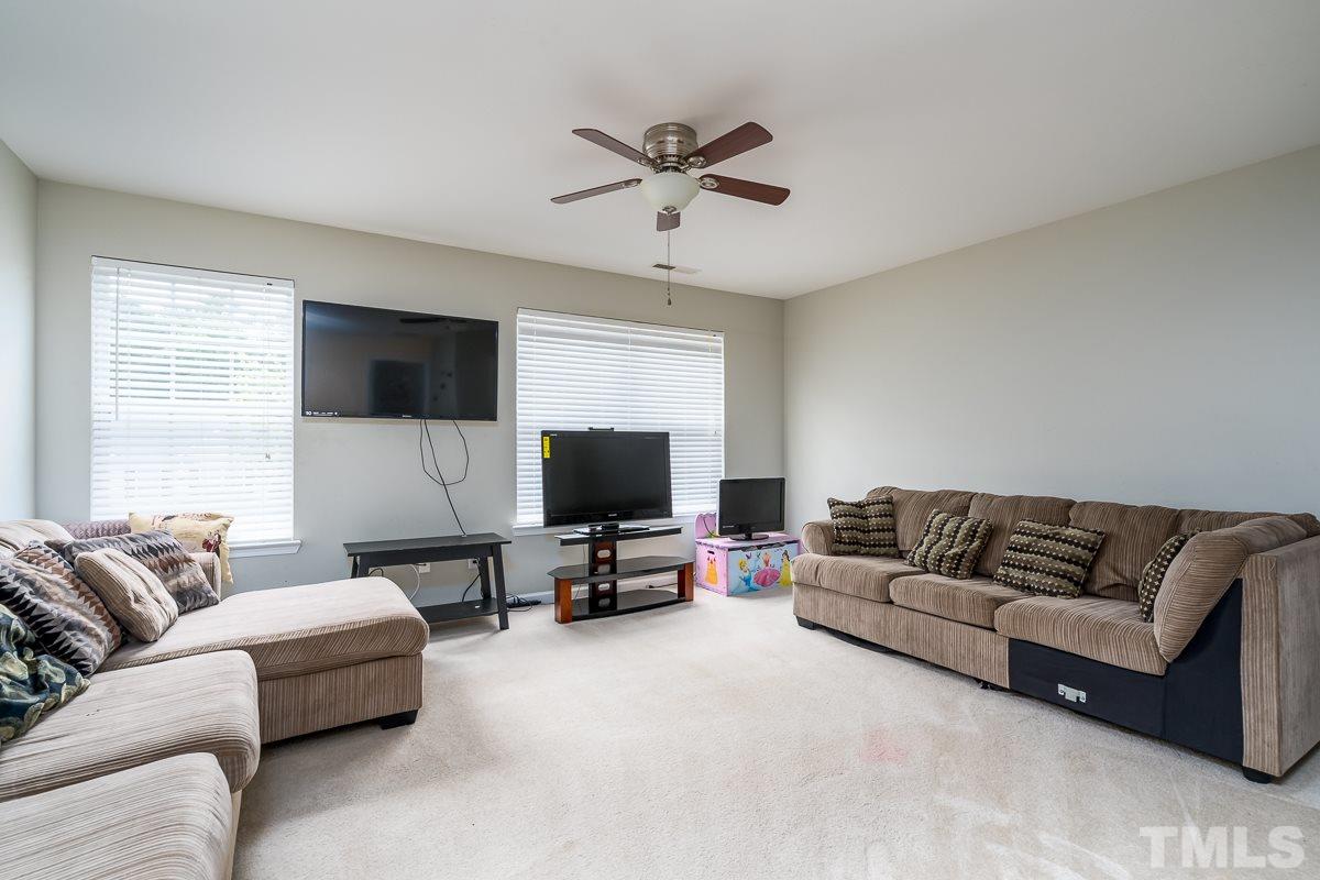 3612 Weir Way Raleigh, NC 27616 - Photo 10 of 19 a living room with furniture and a flat screen tv