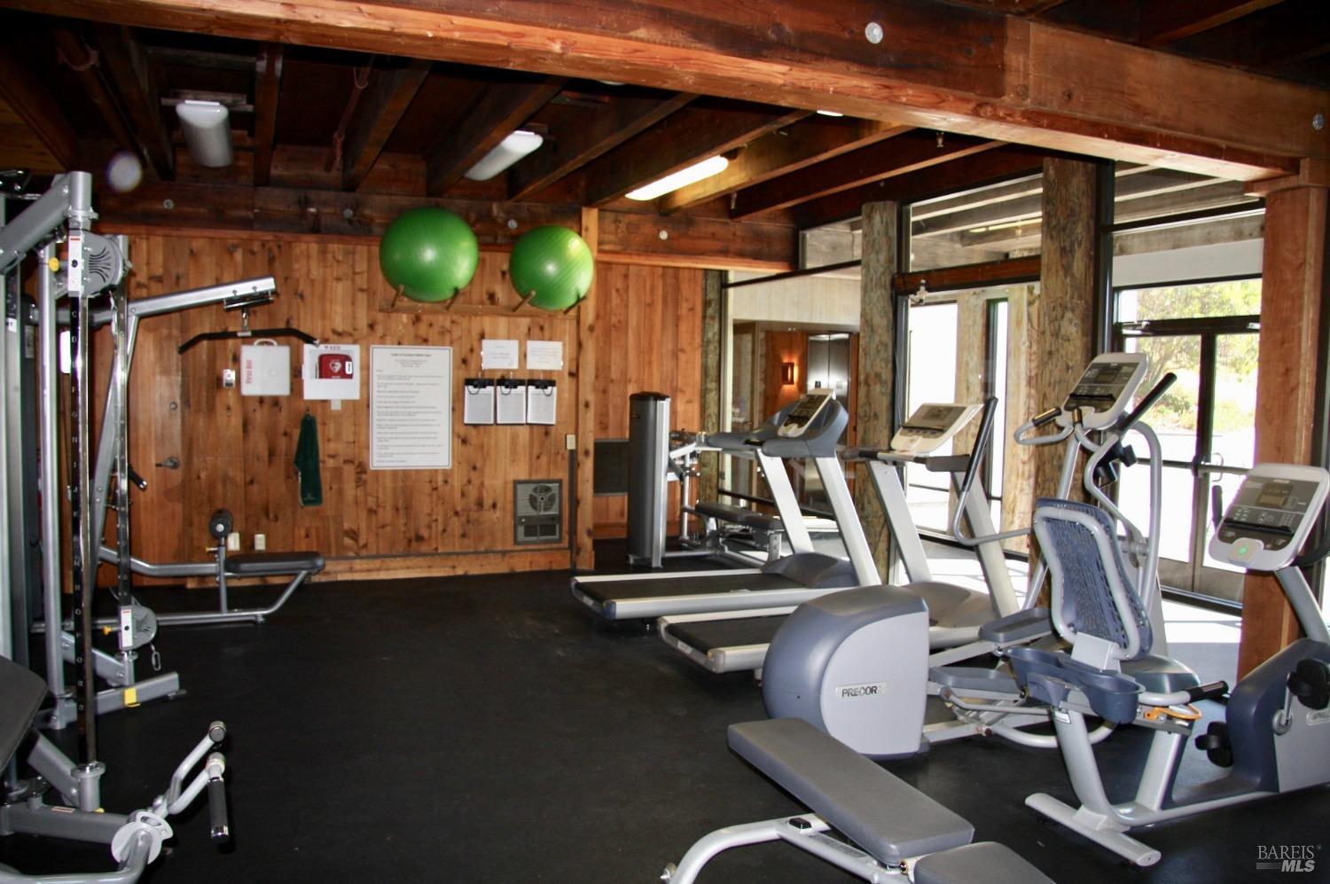21165 Hummingbird Court Bodega Bay, CA 94923 - Photo 18 of 26 a room with gym equipment and mirrors