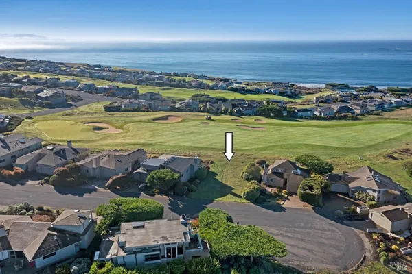 an aerial view of a ocean beach and outdoor space