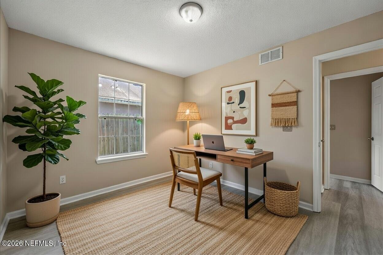 4527 Clairmont Road Jacksonville, FL 32207 - Photo 30 of 40 a living room with furniture and a potted plant