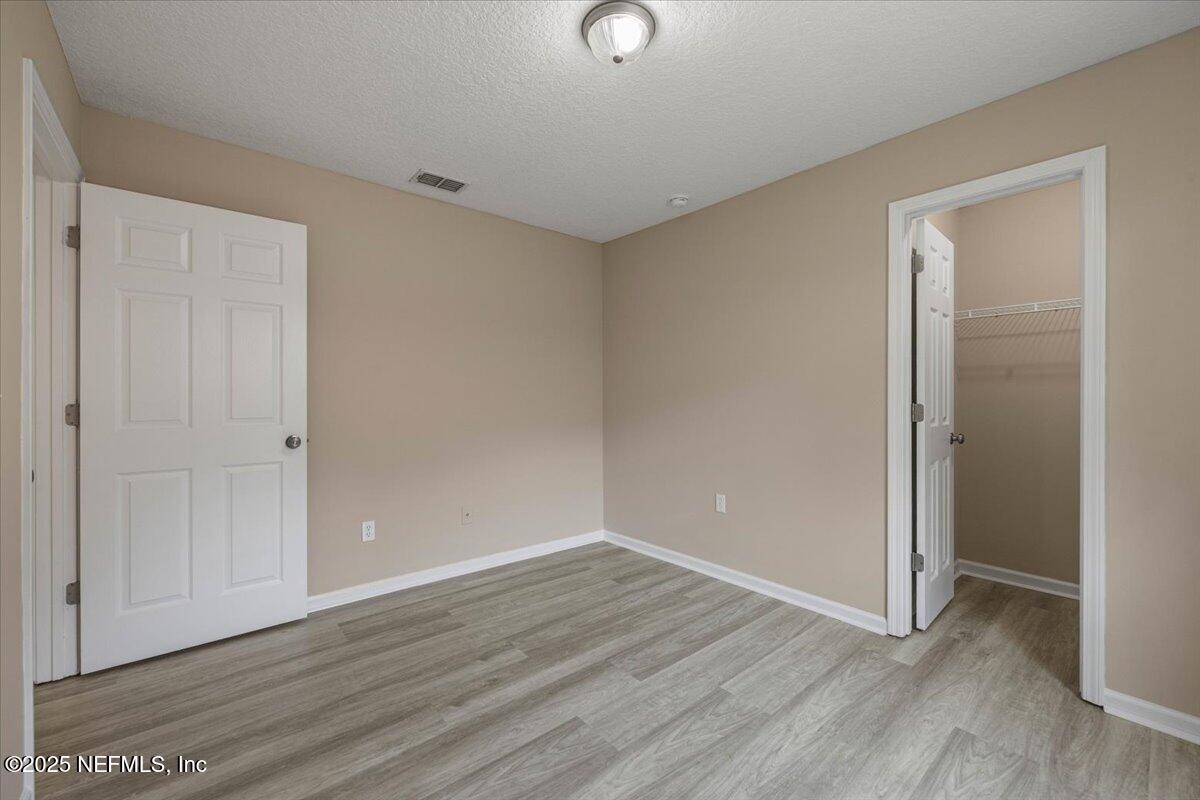 4527 Clairmont Road Jacksonville, FL 32207 - Photo 32 of 40 a view of an empty room with wooden floor