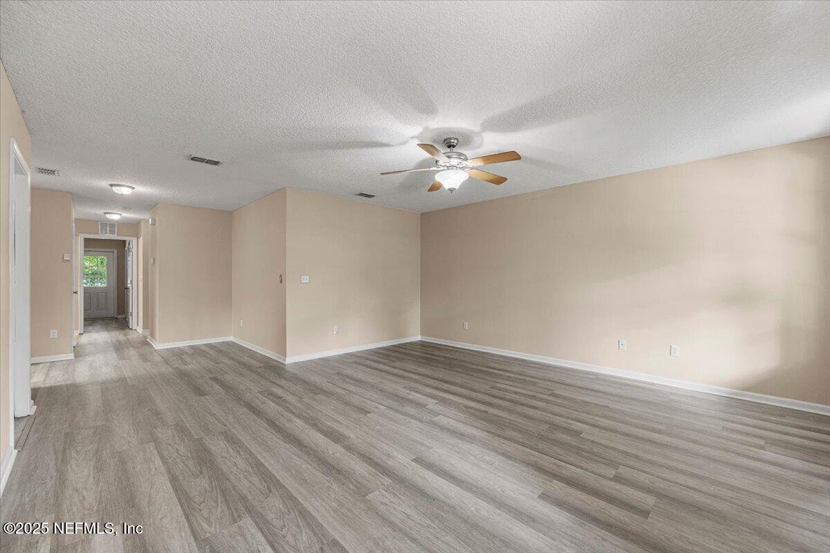 4527 Clairmont Road Jacksonville, FL 32207 - Photo 7 of 40 a view of an empty room with wooden floor