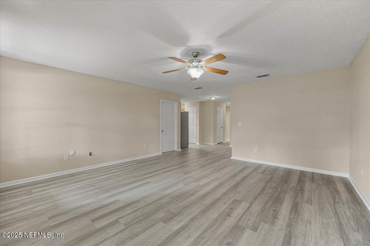 4527 Clairmont Road Jacksonville, FL 32207 - Photo 8 of 40 a view of an empty room and chandelier fan