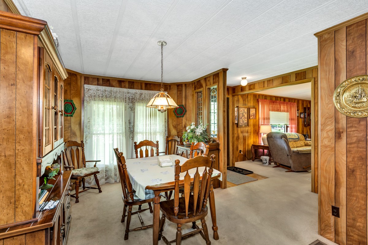272 Jones Road Taft, TN 38488 - Photo 13 of 40 a dining room with furniture and a chandelier