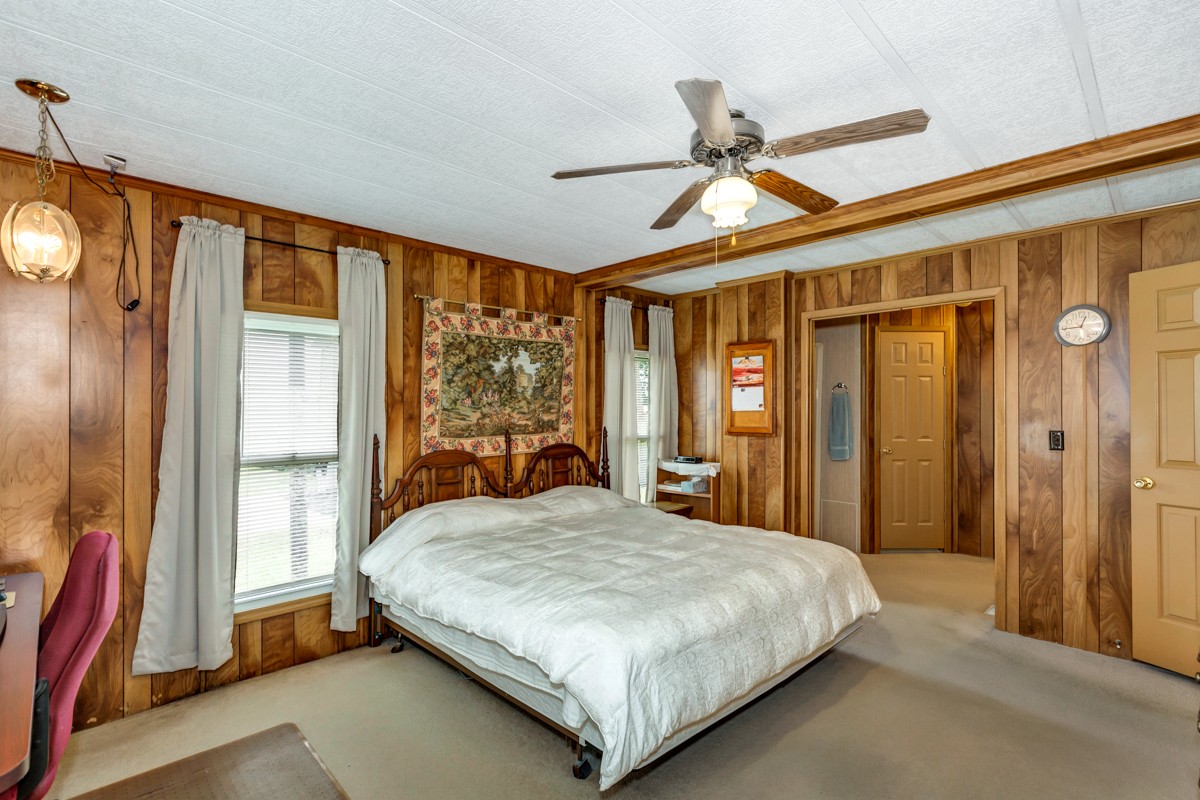 272 Jones Road Taft, TN 38488 - Photo 15 of 40 a bedroom with a large bed and a large window