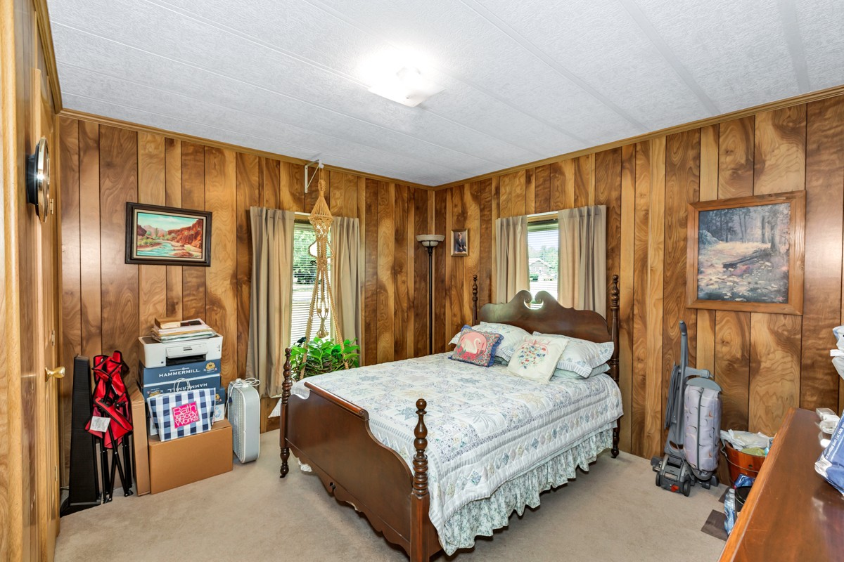 272 Jones Road Taft, TN 38488 - Photo 18 of 40 a bedroom with a bed and a window