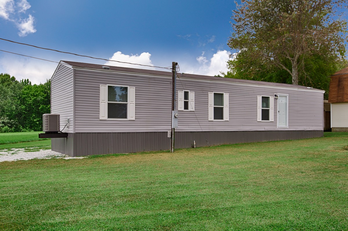 272 Jones Road Taft, TN 38488 - Photo 23 of 40 a front view of a house with garden