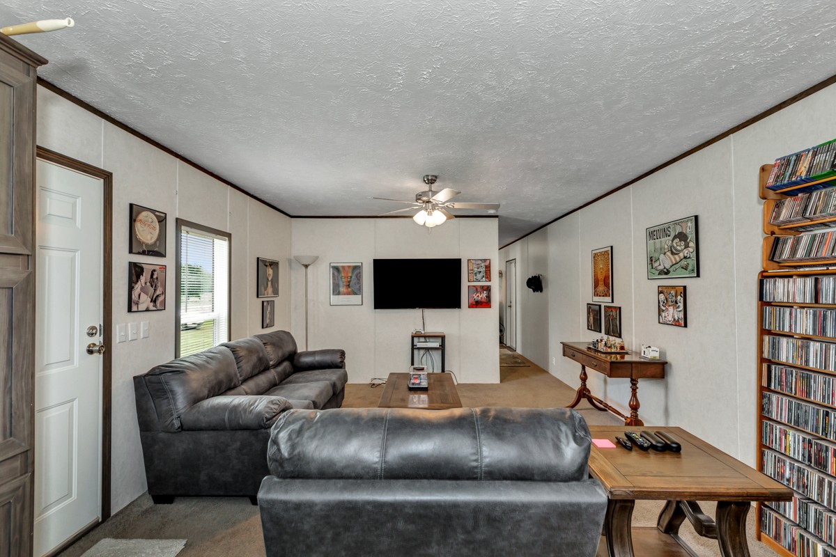272 Jones Road Taft, TN 38488 - Photo 25 of 40 a living room with furniture and a flat screen tv