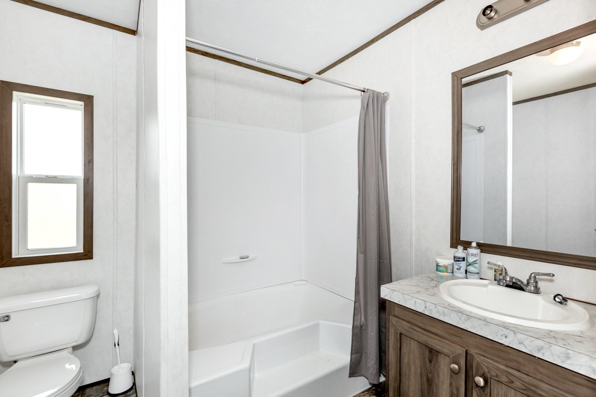 272 Jones Road Taft, TN 38488 - Photo 30 of 40 a bathroom with a granite countertop sink toilet and shower