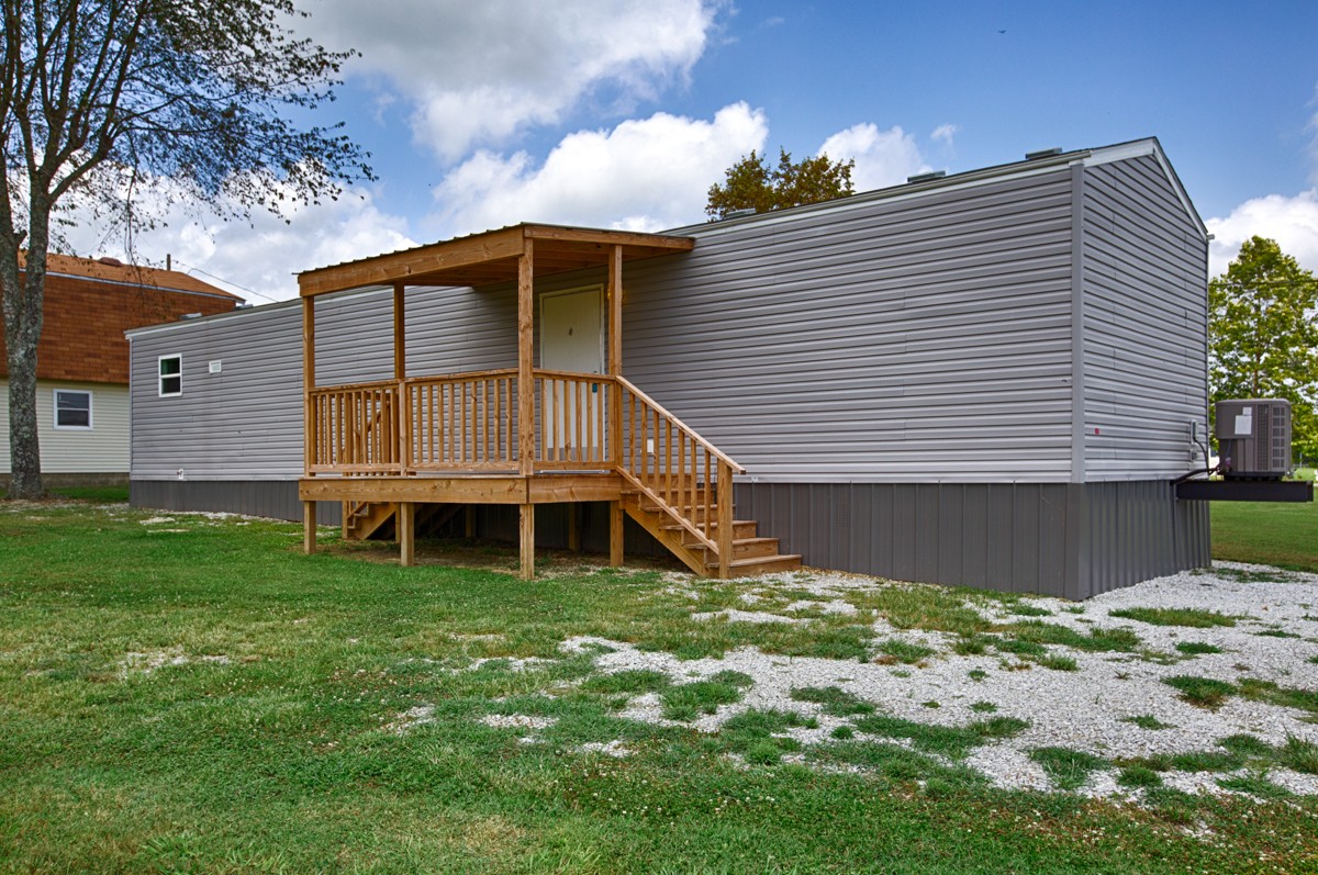 272 Jones Road Taft, TN 38488 - Photo 33 of 40 a view of a house with a yard