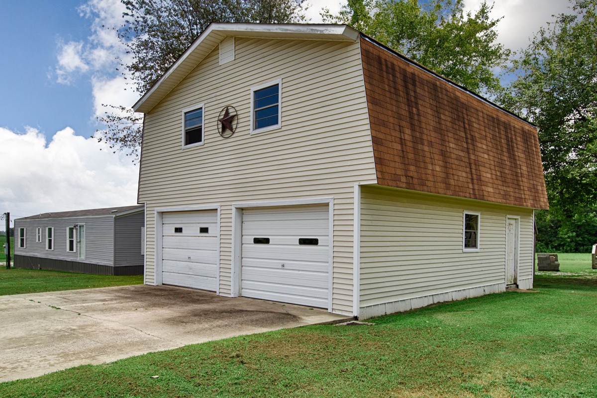 272 Jones Road Taft, TN 38488 - Photo 34 of 40 a view of a house with a backyard