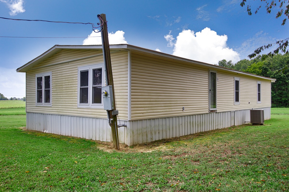 272 Jones Road Taft, TN 38488 - Photo 36 of 40 a view of a house with a yard