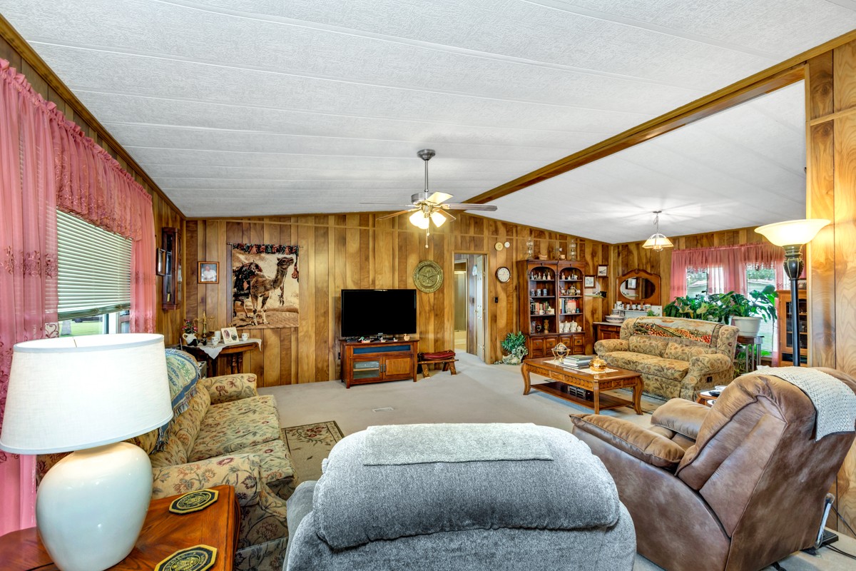 272 Jones Road Taft, TN 38488 - Photo 6 of 40 a living room with furniture a flat screen tv and a large window
