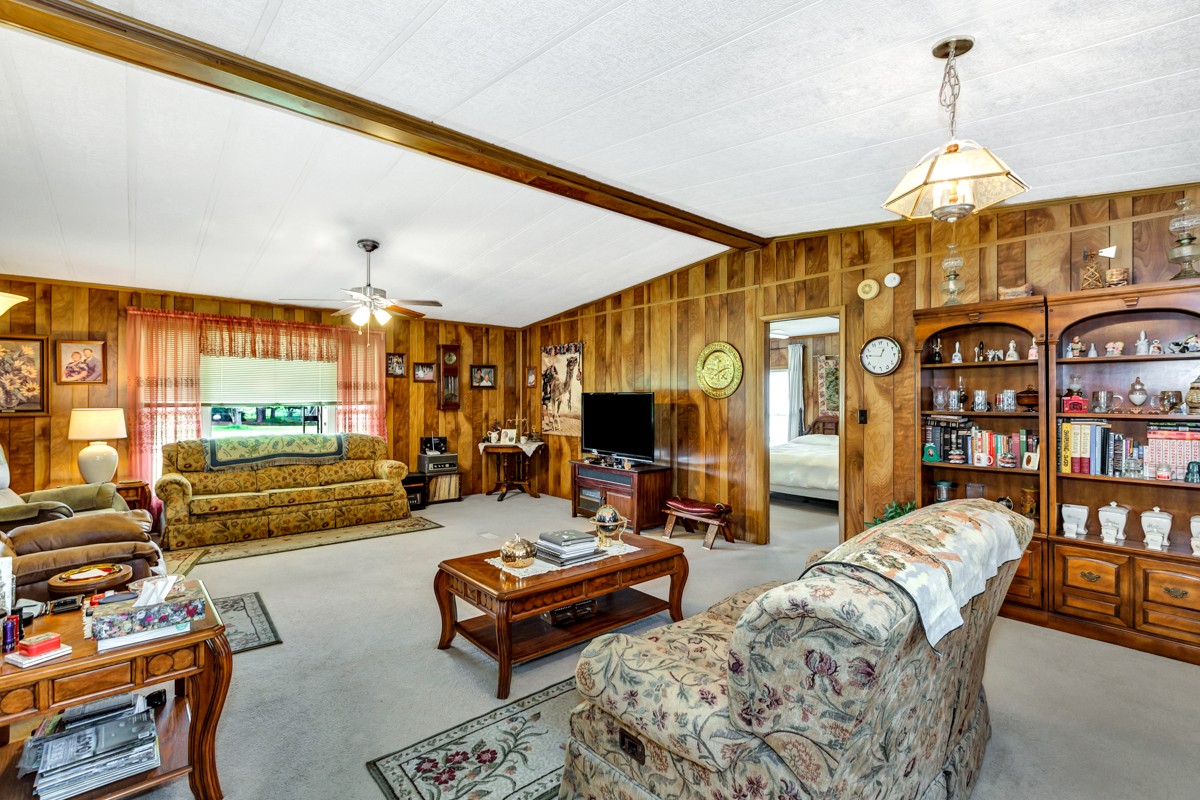 272 Jones Road Taft, TN 38488 - Photo 7 of 40 a living room with furniture a rug and a large window