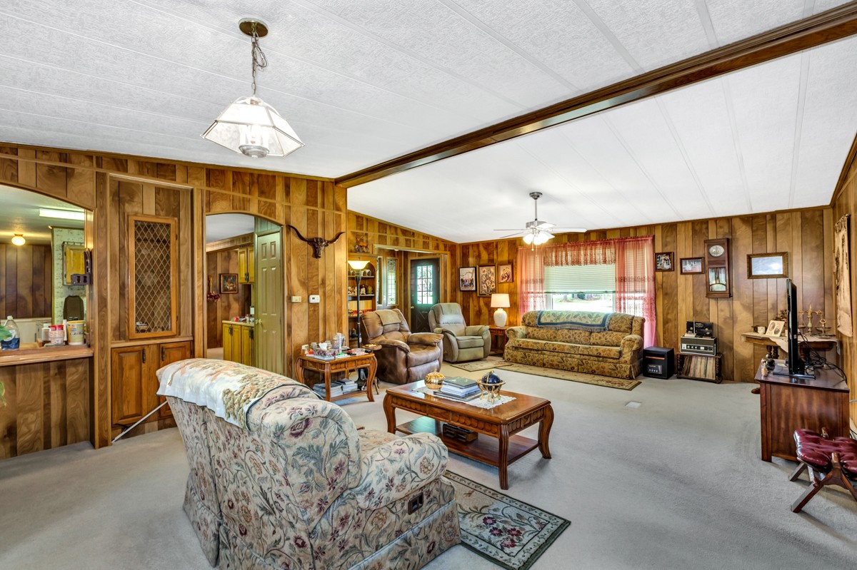 272 Jones Road Taft, TN 38488 - Photo 8 of 40 a living room with furniture and a chandelier