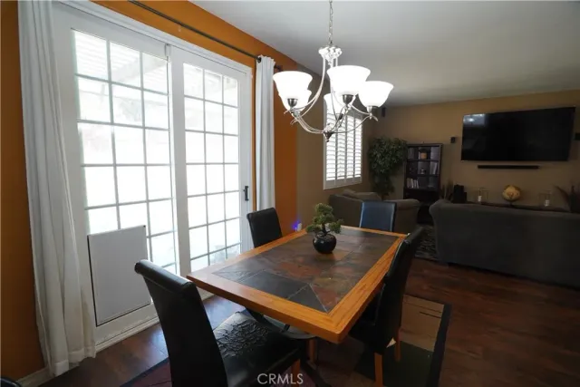 a kitchen with kitchen island granite countertop a sink stove and refrigerator