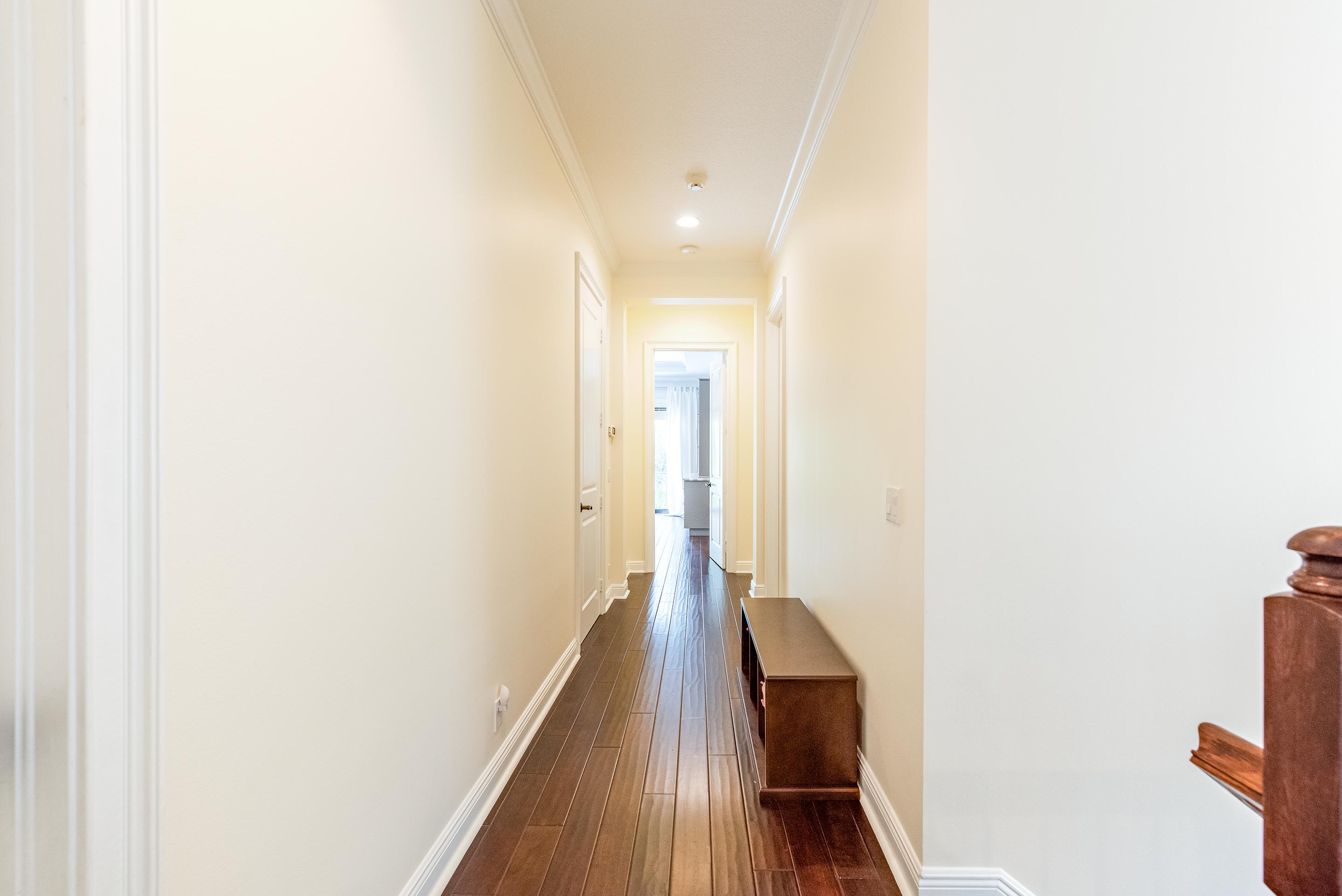 568 Northwest Browning Way Boca Raton, FL 33432 - Photo 16 of 51 Hallway To Master Bedroom