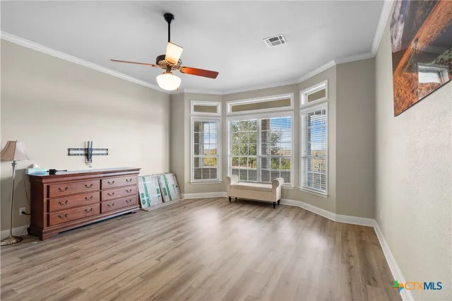 a view of a kitchen with a stove wooden floor and a window