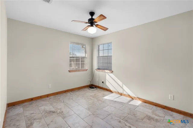 a view of livingroom with hardwood floor and a ceiling fan