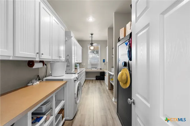 a view of a kitchen with appliances and cabinets