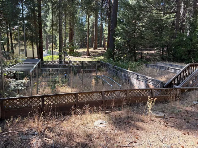 a view of a swimming pool with a patio