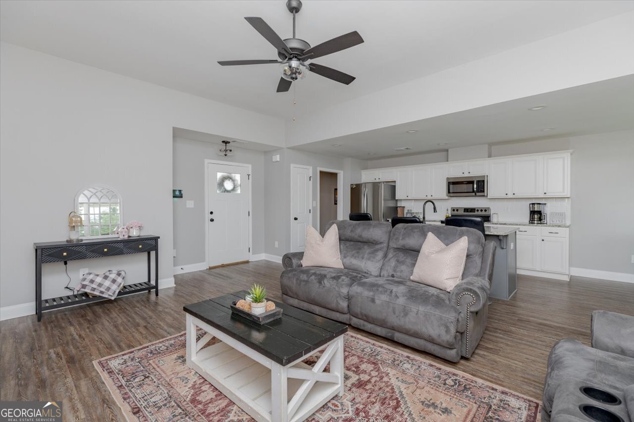 104 Meredith Layne Court Perry, GA 31069 - Photo 6 of 46 a living room with furniture and a wooden floor