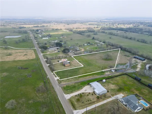a view of swimming pool with a yard
