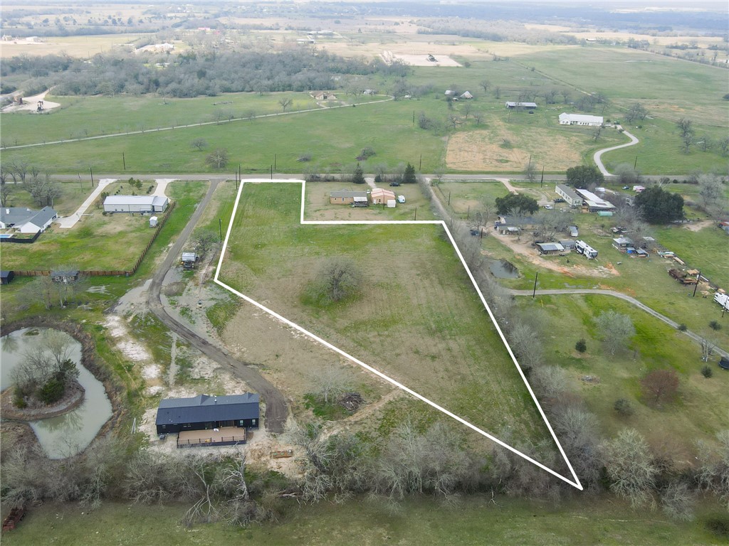 10826 Forsthoff Road Bryan, TX 77808 - Photo 5 of 11 a view of swimming pool with a yard