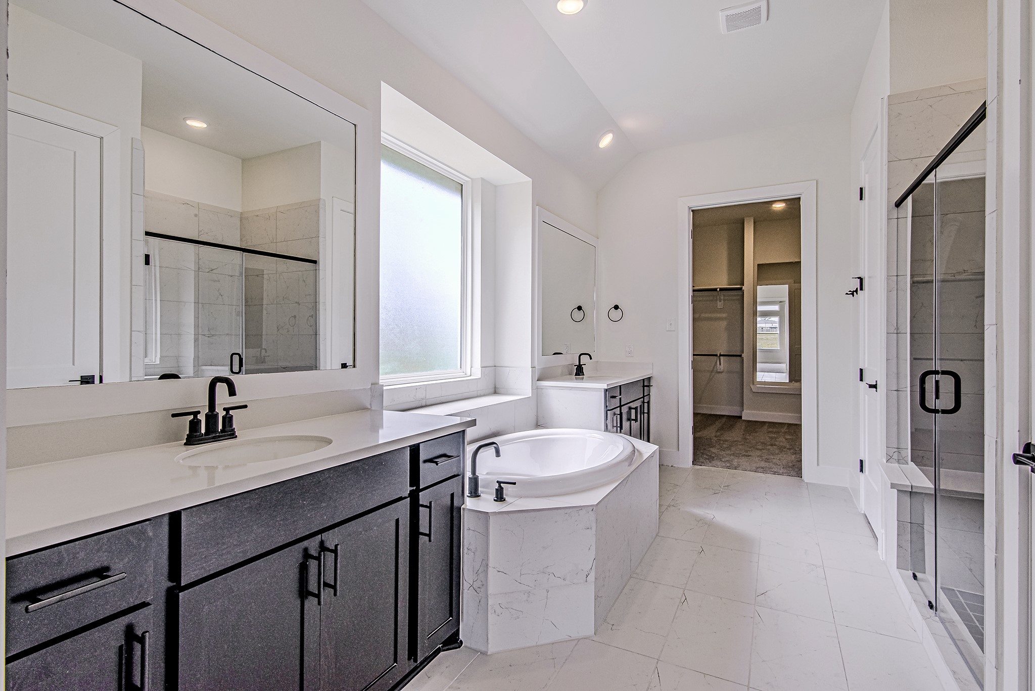 157 Peninsula Point Drive Montgomery, TX 77356 - Photo 16 of 33 a bathroom with a double vanity sink mirror double and bathtub