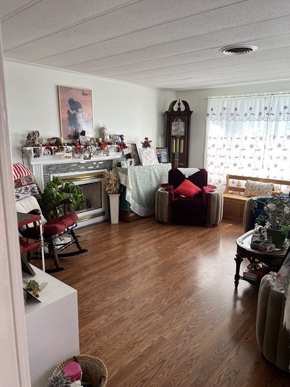53 Wagon Hill Road Marlborough, MA 01752 - Photo 13 of 32 a living room with furniture fireplace and window