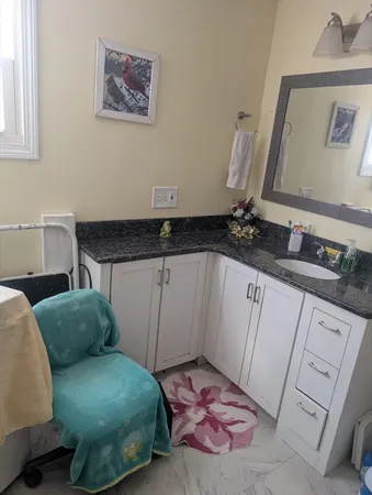 a bedroom with a bed and a mirror