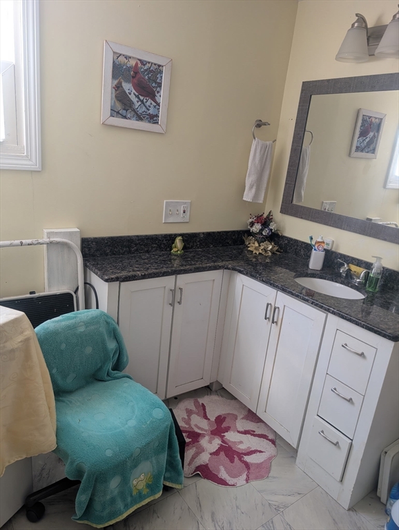 53 Wagon Hill Road Marlborough, MA 01752 - Photo 18 of 32 a bedroom with a bed and a mirror