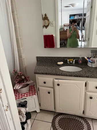 a bathroom with sink and mirror