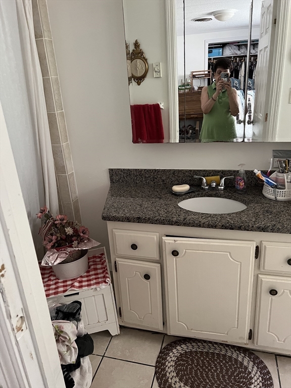 53 Wagon Hill Road Marlborough, MA 01752 - Photo 23 of 32 a bathroom with sink and mirror