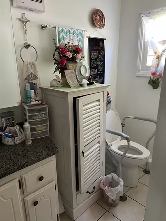 a bathroom with a sink toilet and mirror