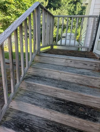 a view of a house with a street