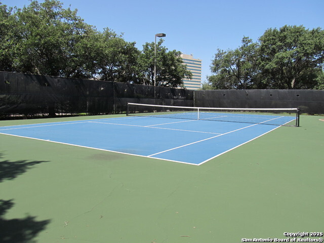 7701 Wurzbach Road, Unit 301 San Antonio, TX 78229 - Photo 12 of 42 a view of a tennis court