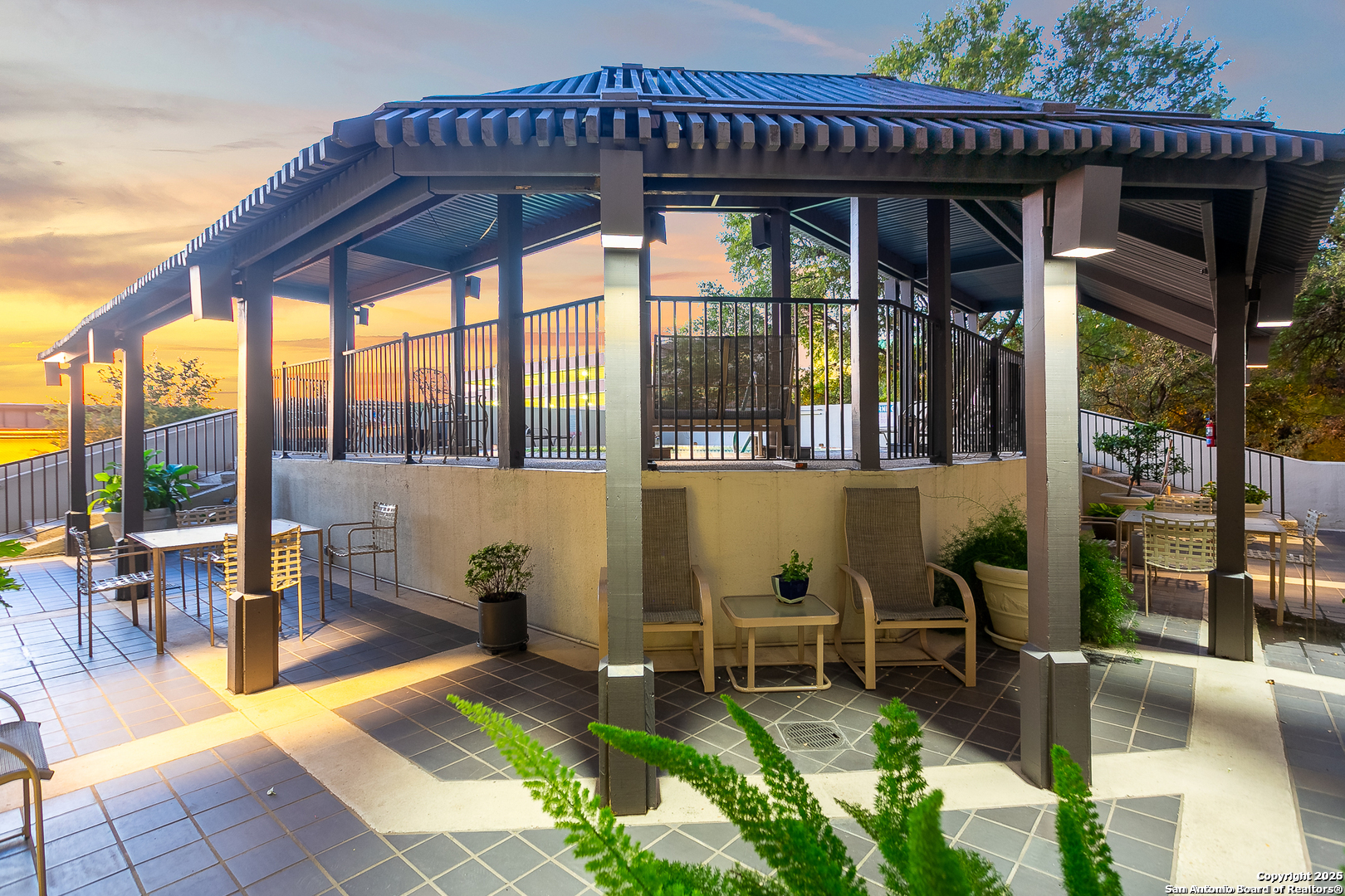 7701 Wurzbach Road, Unit 301 San Antonio, TX 78229 - Photo 13 of 42 a view of a chairs and table in the patio with a swimming pool